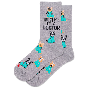 Person wearing white sneakers, gray socks with dog illustrations, and a teal outfit with a stethoscope.