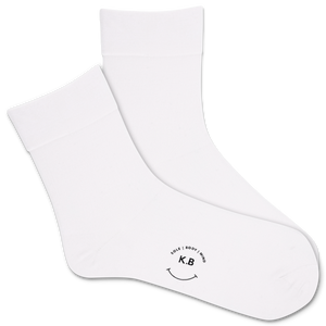 White socks with a smiley face and 'K.B' logo on a white background