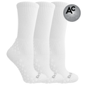 Three white ribbed crew socks with raised grip dots on the sole and heel, shown on a white background with a silver award badge reading Design Excellence Awards 2026 Design Finalist.