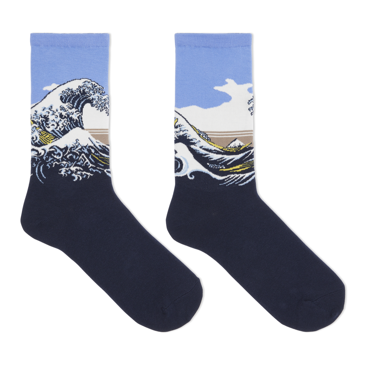 A pair of crew socks featuring a graphic print of Katsushika Hokusai's Great Wave off Kanagawa. The lower half of the socks is a solid dark navy blue, while the upper half features the wave illustration with a light blue sky, white foam, and a tan mountain range.