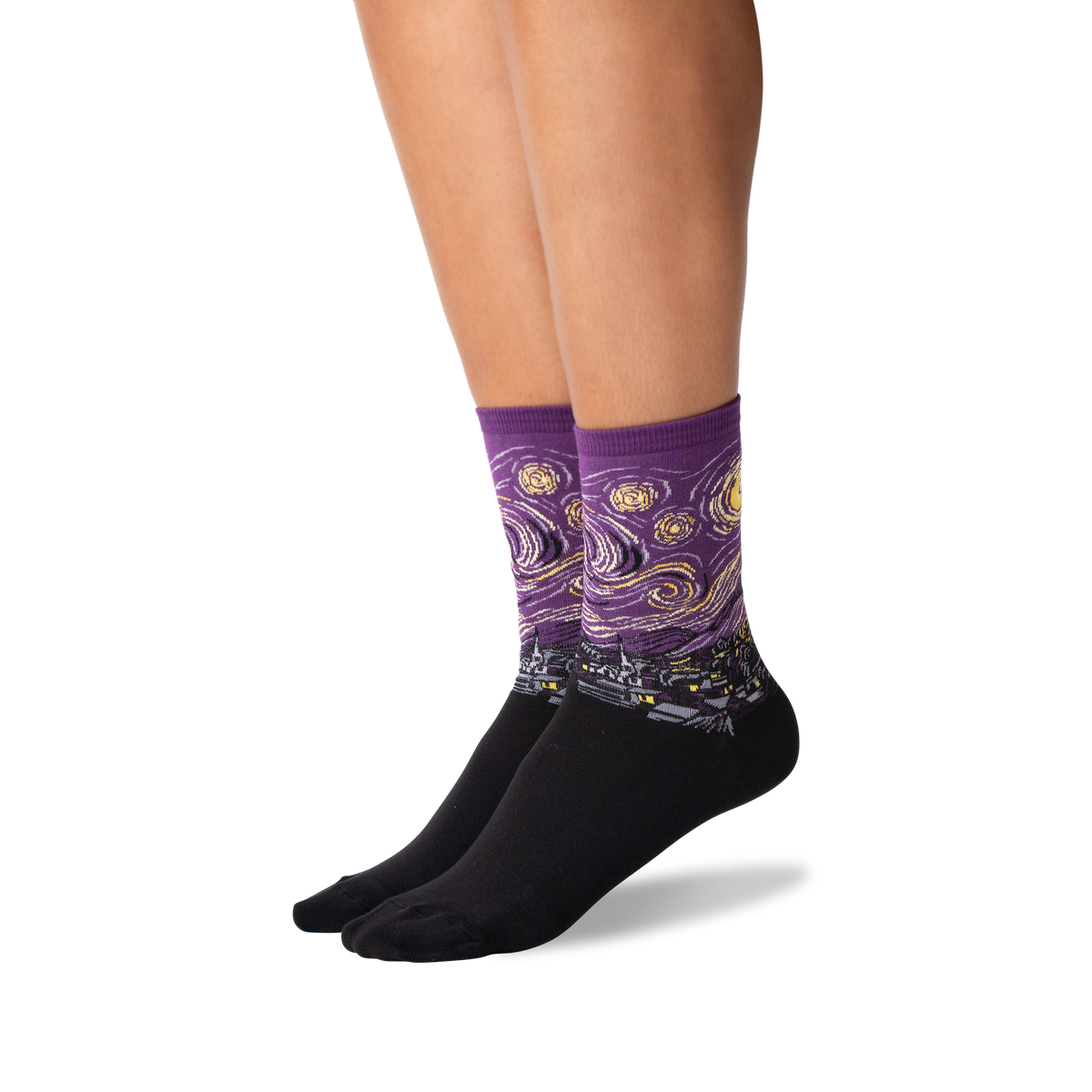 A pair of low-cut crew socks worn on a person's feet, featuring a purple and black Van Gogh-inspired swirling pattern with yellow moon and star details, shown against a plain white background.