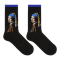 A pair of black crew socks featuring a stylized graphic of Vermeer's Girl with the Pearl Necklace, shown against a plain white background.