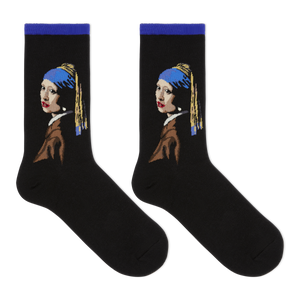A pair of black crew socks featuring a stylized graphic of Vermeer's Girl with the Pearl Necklace, shown against a plain white background.