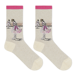 A pair of crew socks with a light beige body, featuring Edgar Degas' "Study of a Dancer" artwork of ballerinas in pink tutus on the upper leg, finished with a bright pink cuff and toe/heel accents.