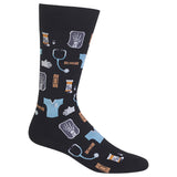 A single crew sock on a plain white background, featuring a dark charcoal/black base with a medical-themed pattern of light blue scrubs, a stethoscope, white gloves, and pill bottles with orange details. thumbnail