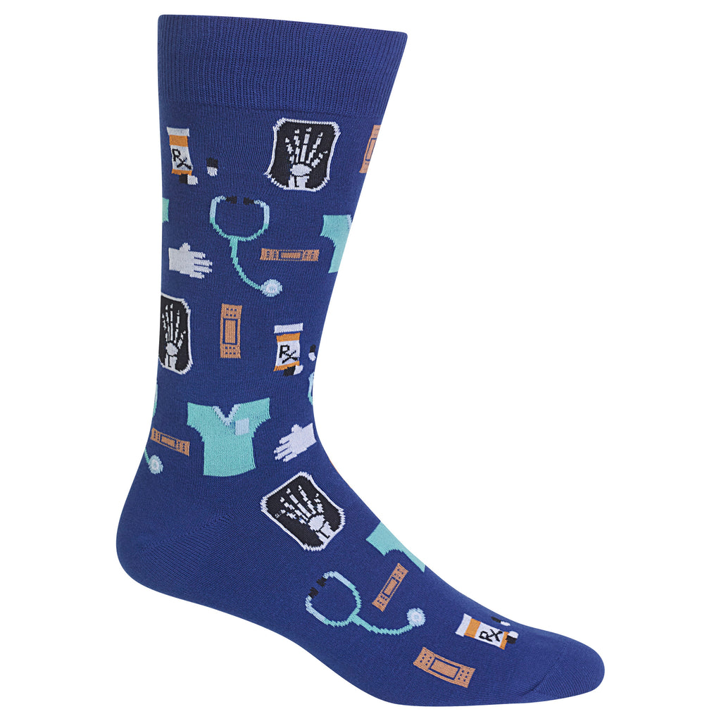 A single crew sock in dark blue with a medical-themed print featuring stethoscopes, X-ray images, pills, and a teal scrub top on a white background.
