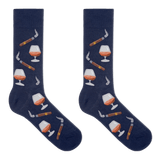 A pair of navy blue crew socks with a repeating pattern of cigars, smoking pipes, and cognac whiskey glasses, displayed against a solid white background.