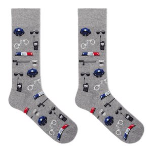 A pair of heather gray crew socks featuring a repeating pattern of police-themed items including blue police hats, walkie-talkies, handcuffs, batons, and red-and-blue light bars, shown on a plain white background.