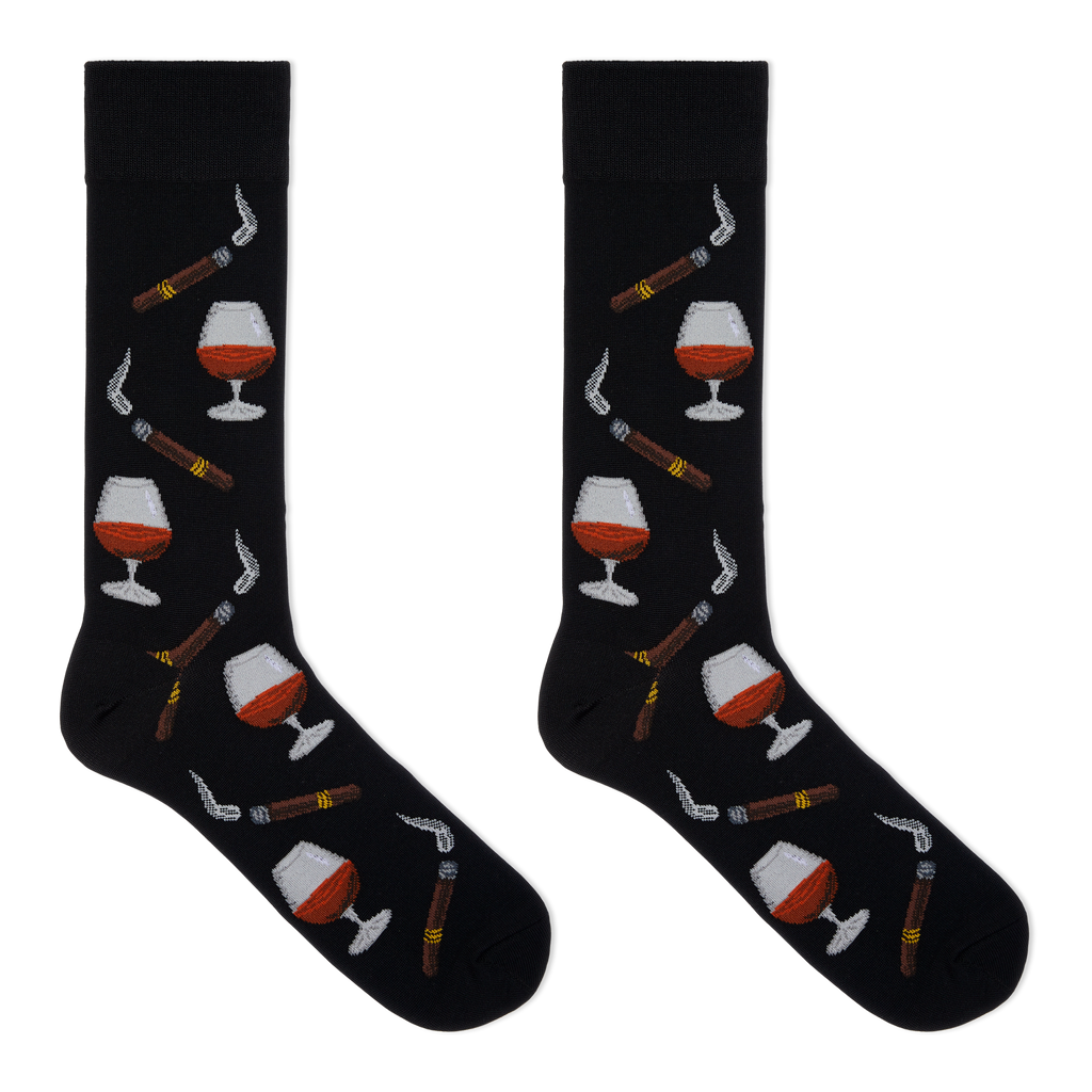 A pair of black crew socks with a repeating pattern of cognac whiskey glasses, cigars, and smoking pipes, displayed flat against a solid white background.