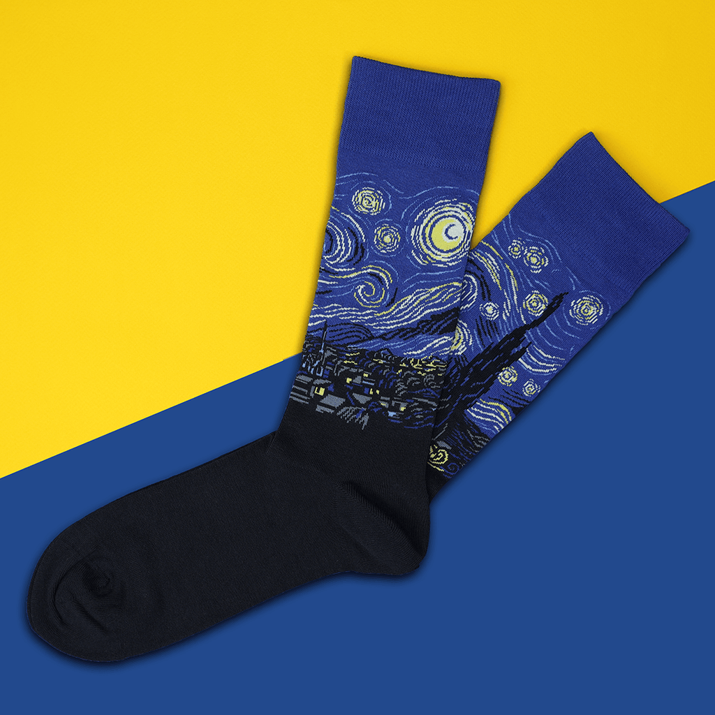 Pair of socks with 'Starry Night' design on a yellow and blue background