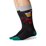 A pair of novelty crew socks worn on a person's feet, featuring a dark charcoal body with red text reading 'JOLLY AF', a cocktail graphic, a gray cuff, and teal toes and heels. thumbnail