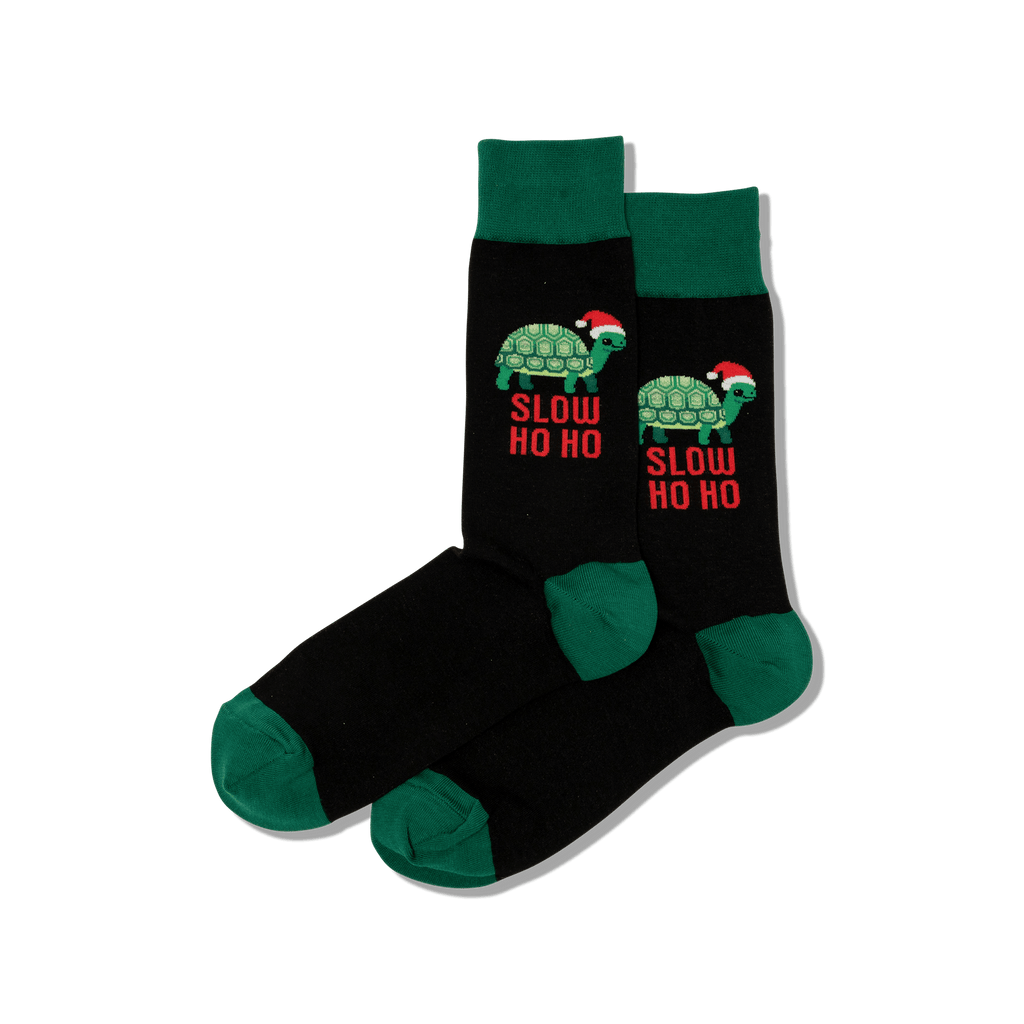Black socks with turtle design and 'Slow Ho Ho' text on a transparent background