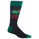 A single dark charcoal gray crew sock with green cuffs, heel, and toe, featuring a green turtle wearing a red Santa hat and the red text 'SLOW HO HO' on the side. thumbnail