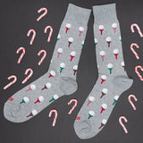 Gray socks with candy cane and golf ball patterns on a black background thumbnail