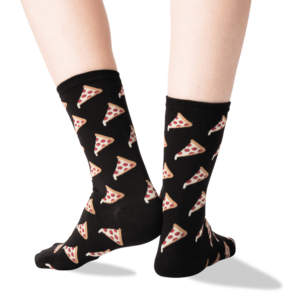 Black crew socks with a repeating pattern of pizza slices, shown on a person's feet against a clean white background.