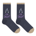 A pair of dark heather navy crew socks with beige toes and heels, featuring a white wishbone graphic and the text 'OH SNAP!' in lavender on the side, shown against a plain white background.