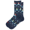 A pair of navy blue crew socks with a repeating pattern of penguins on ice, snowflakes, and small red accents.