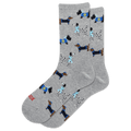A pair of heather gray crew socks featuring an all-over pattern of various dogs in navy blue and black Hanukkah-inspired outfits, with one sock showing the red text 'HOTSOX' near the toe.
