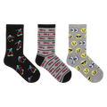 Three pairs of novelty crew socks displayed side-by-side on a plain white background. The left pair is black with colorful cartoon skateboarder prints.