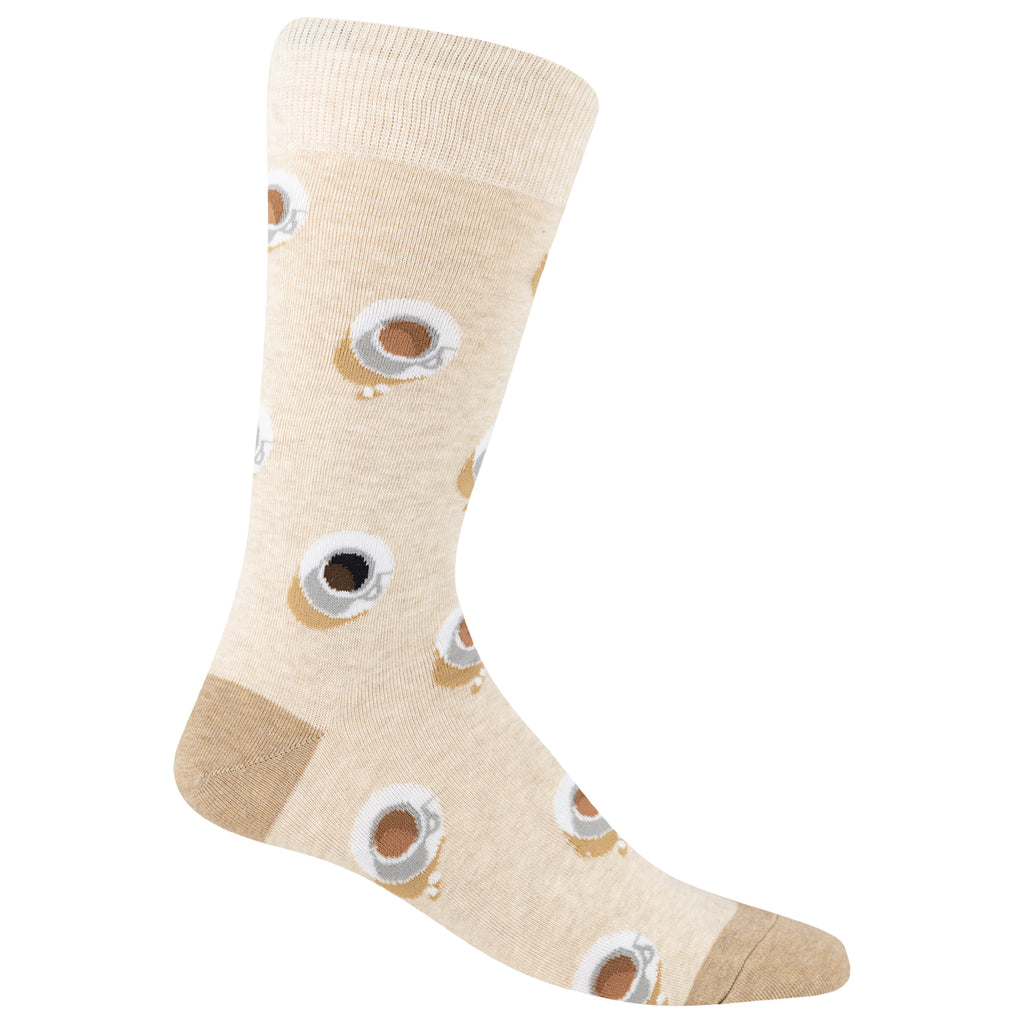 A single crew sock in a light beige heathered fabric, decorated with a repeating pattern of coffee cups with steam and small coffee drips. The sock features a solid tan heel and toe, and is shown against a plain white background.