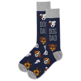 A pair of navy blue crew socks with a gray heel, toe, and cuff, featuring a repeating pattern of dog faces and the words 'DOG DAD' in gray.