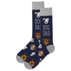 A pair of navy blue crew socks with a gray heel, toe, and cuff, featuring a repeating pattern of dog faces and the words 'DOG DAD' in gray.