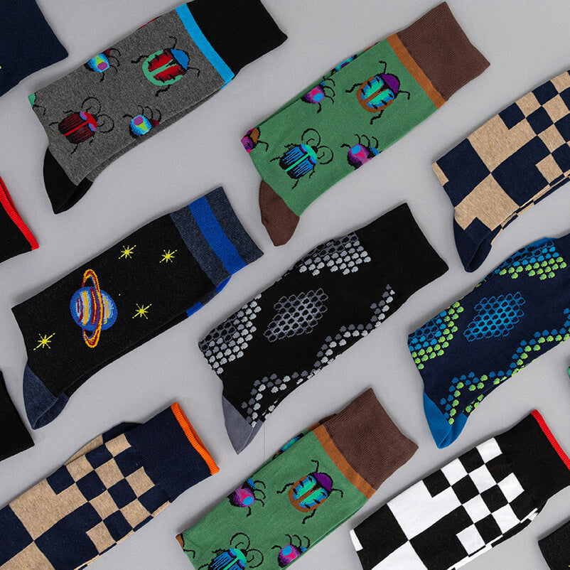 Collection of colorful mens socks with various patterns on a light gray background