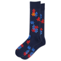 A pair of navy blue crew socks featuring a pattern of red and blue puzzle pieces, displayed against a solid white background.