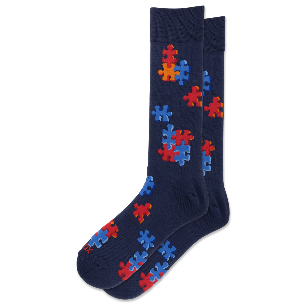 A pair of navy blue crew socks featuring a pattern of red and blue puzzle pieces, displayed against a solid white background.