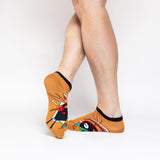 Colorful socks with abstract Kandinsky design worn by a person on a white background thumbnail