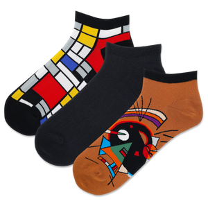 Three pairs of socks with abstract designs on a white background