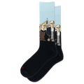 A pair of crew socks on a plain white background. The socks are black with Grant Woods' "American Gothic" on a light blue background, and a small red 'HOTSOX' logo near the toe.
