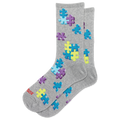 A pair of heather gray crew socks with a pattern of colorful puzzle pieces in blue, purple, and yellow. The brand name 'HOTSOX' is printed in red on the toe area.