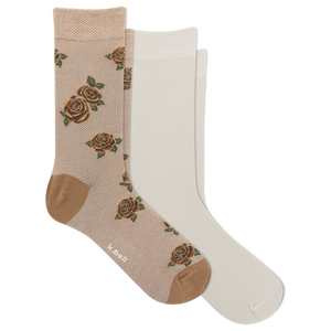 Two pairs of crew socks on a plain white background: one pair is beige with a brown rose pattern and tan heel/toe areas, and the other pair is solid off-white. The brand name 'k-ball' is visible on the patterned sock.
