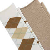 Two pairs of knit socks arranged diagonally on a white background. The front pair is off-white with an argyle pattern in brown, tan, and light blue, and the second pair is a solid heathered beige. thumbnail
