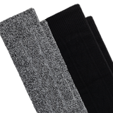 Two pairs of knit boot socks stacked diagonally on a white background, showing a heathered gray-and-black marled texture on the front pair and solid black on the rear pair.