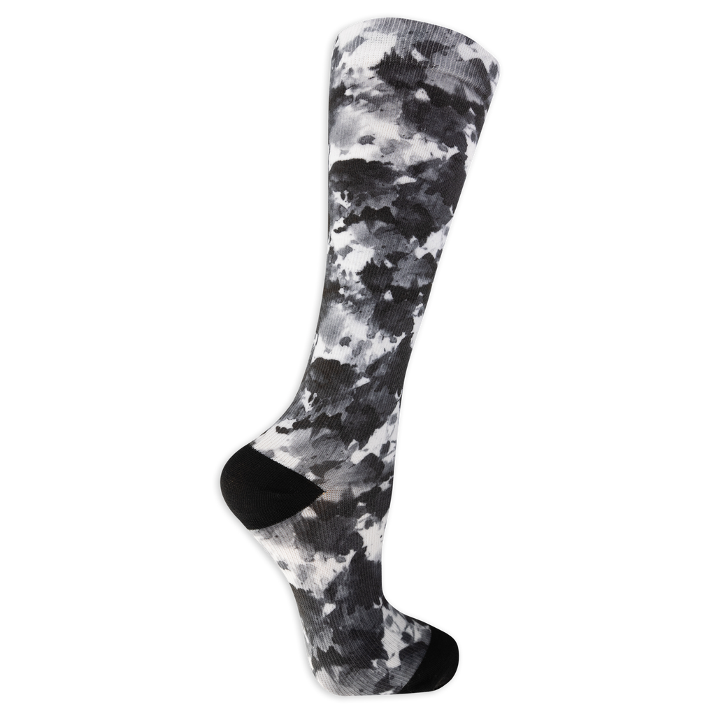 Dr. Scholl's women's compression socks featuring a blue, pink and white tie dye pattern and black accents at the heel and toe.