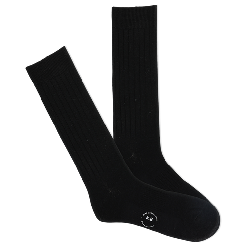 A pair of black ribbed crew socks with a visible K.Bell brand logo on the sole.