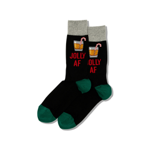 Black socks with red text and candy cane designs on a white background