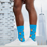 Person wearing blue socks with hot dog design in front of a city skyline thumbnail