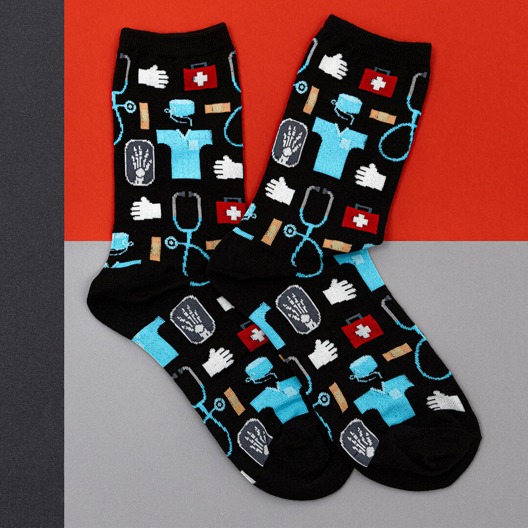 Pair of socks with medical-themed design on a red and gray background