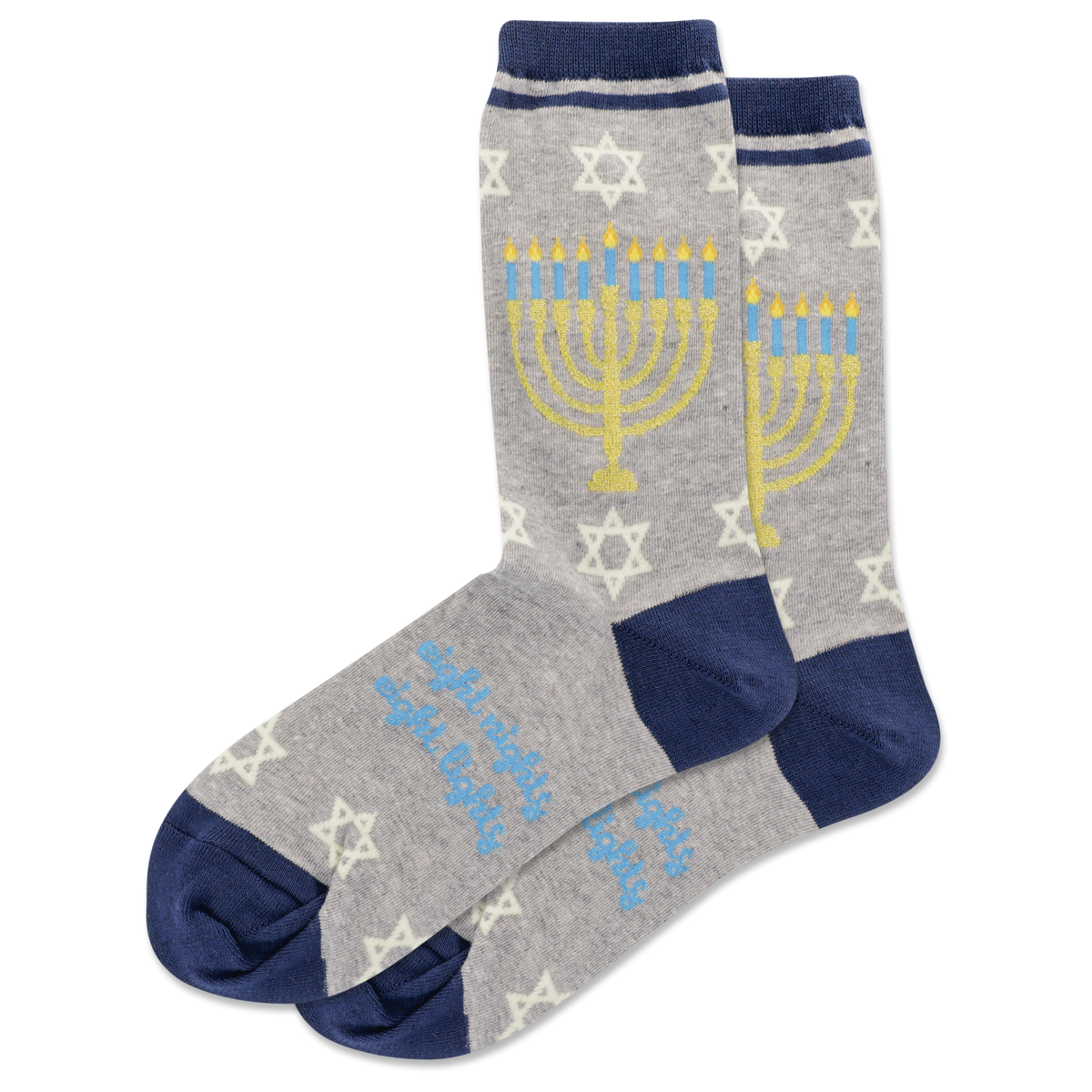 Person wearing socks with Menorah designs on a wooden floor