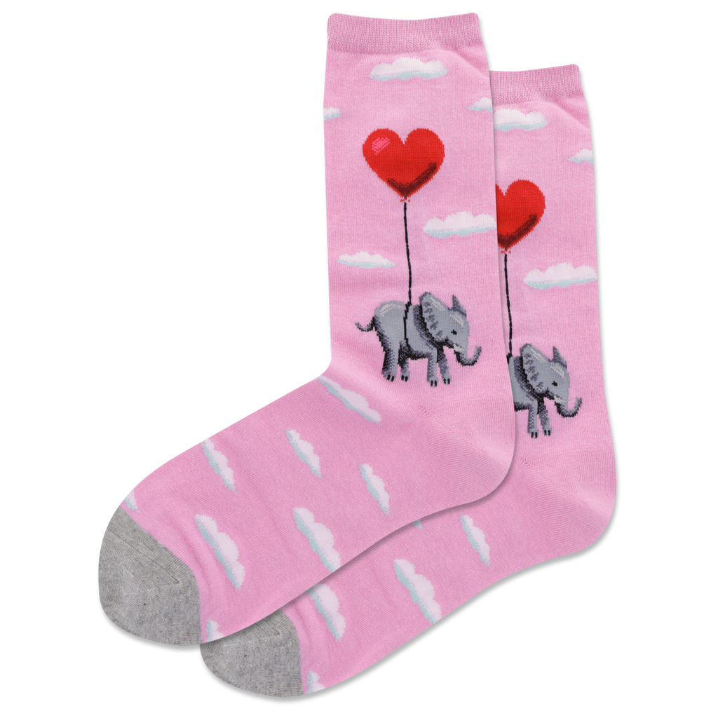 A pair of pink crew socks with a pattern of white clouds, an elephant, and a heart-shaped balloon.