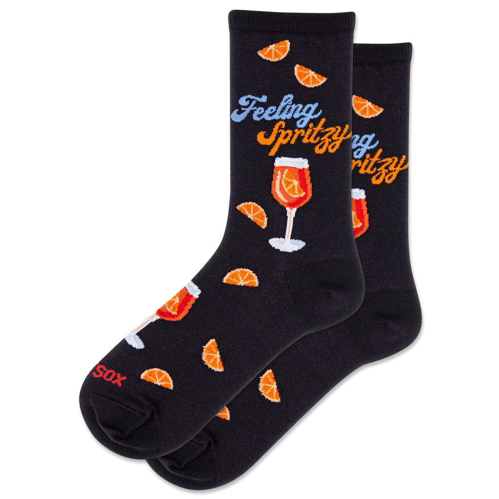Black socks with orange slices and a glass of wine design on a white background
