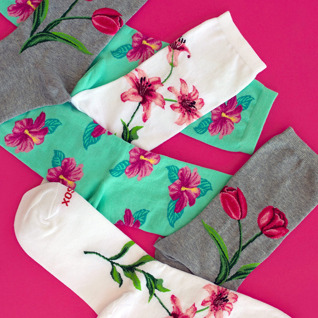 Sock scatter of three floral-themed women's HOTSOX.