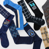 Collection of various socks with different designs and text on a white background