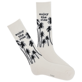 White socks with black palm tree designs and 'enjoy the ride' text on a white background