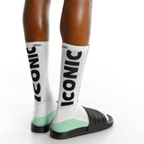 White socks with 'Icon' branding worn by a person on a white background thumbnail