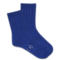 Pair of blue socks with a K.Bell logo on a white background