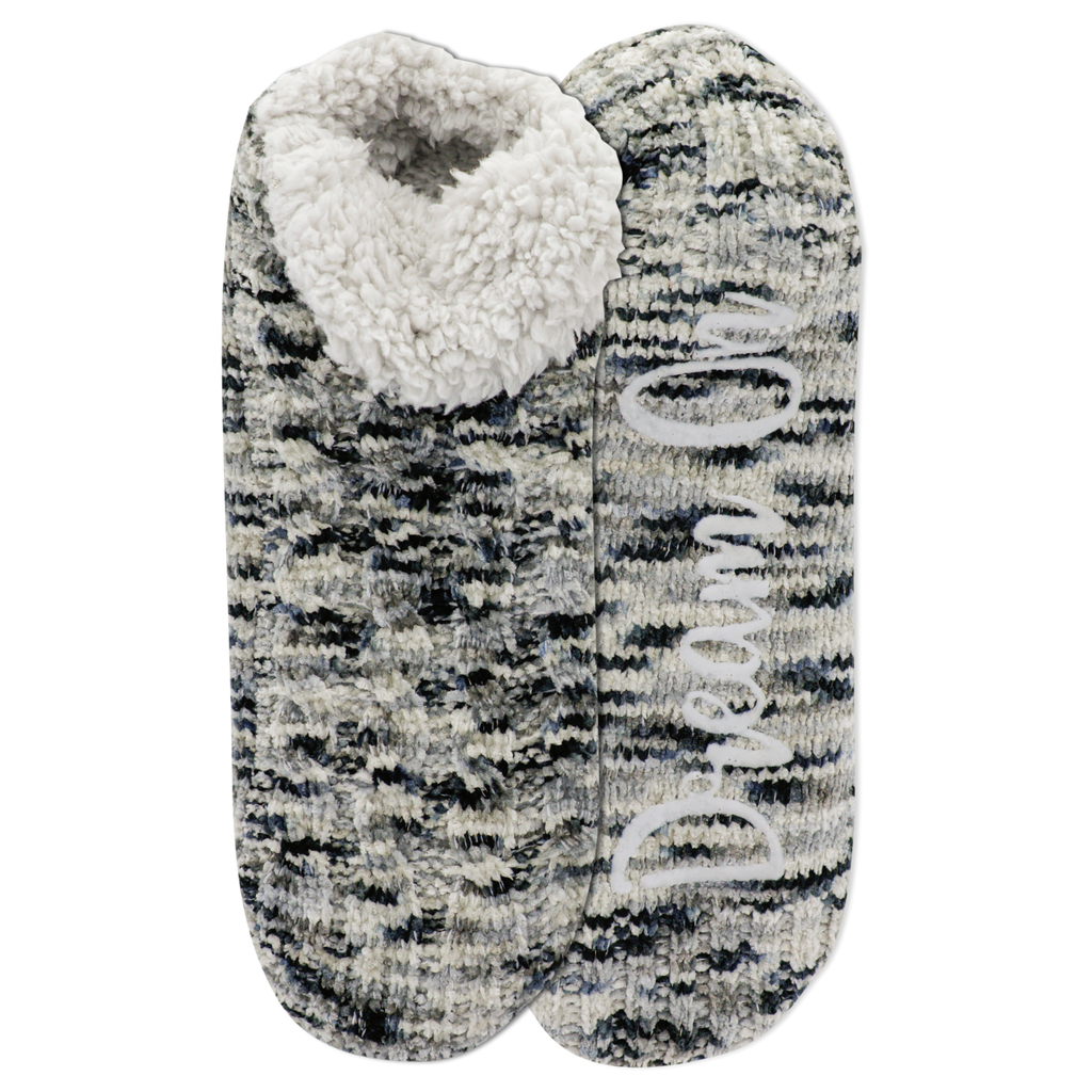 Pair of gray and black patterned slippers with white fleece lining on a white background